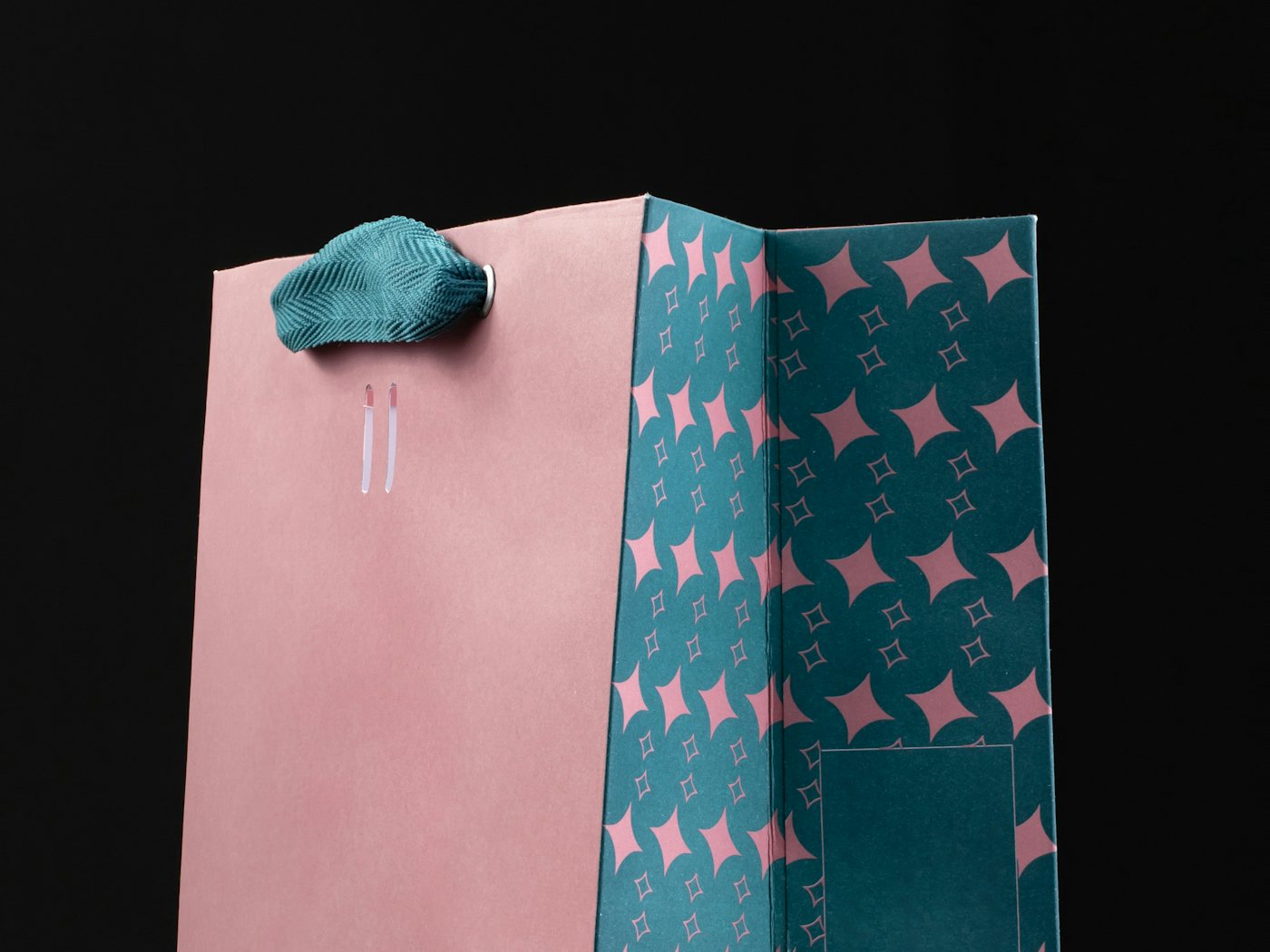 Branded kraft shopping bags on a boutique counter